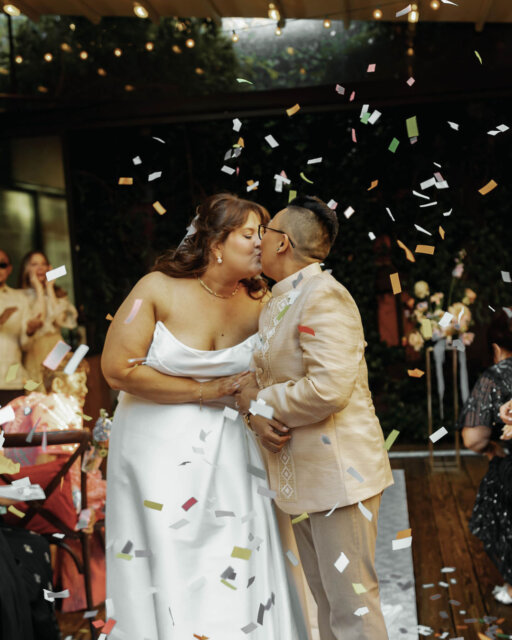 "Nice earrings." That was the line that started it all. ⁠
⁠
Kristin (she/her) and Zen (she/her) met at Henrietta Hudson when Kristin complimented Zen’s earrings. Fast forward through a global pandemic (Zen was visiting from Rome when they met!) and here they are, celebrating their love at My Moon in Brooklyn.⁠
⁠
We are obsessed with how they blended their worlds. We’re talking a reception that featured a traditional Filipino Lechon and Barongs alongside an Italian napkin wave and a massive cookie tray.⁠
⁠
And because Kristin owns a bakery in Queens, she baked the wedding cake and all the desserts herself 🍰⁠
⁠
From the vintage NYC taxi arrival to the 'nice earrings' callback in their vows, this day was pure joy.⁠
⁠
Read the full story of their Brooklyn celebration at the link in the usual spot! 👆⁠
⁠
Featured in @dancingwithher⁠
Photography by @emilydennyphoto⁠
⁠
Artist @sarastolow⁠
Beverage/Dessert @seltzerboys⁠
Cake @buttah_bakery⁠
DJ @marcushodj⁠
Dress Boutique @lovelybridenyc⁠
Dress Designer @louvienne⁠
Florist @hanatonyc⁠
Hair & Makeup @lemondynyc⁠
Live Music @coverstorydoowop⁠
Photobooth @majesticbooths⁠
Rings @artemer & @holdenrings⁠
Signage @the.endiy.shop⁠
Suit @indochino⁠
Transportation @filmcarsny⁠
Venue @mymoonnyc⁠
Videographer @tomlungphoto⁠
Wedding Planner @gracekellyevents