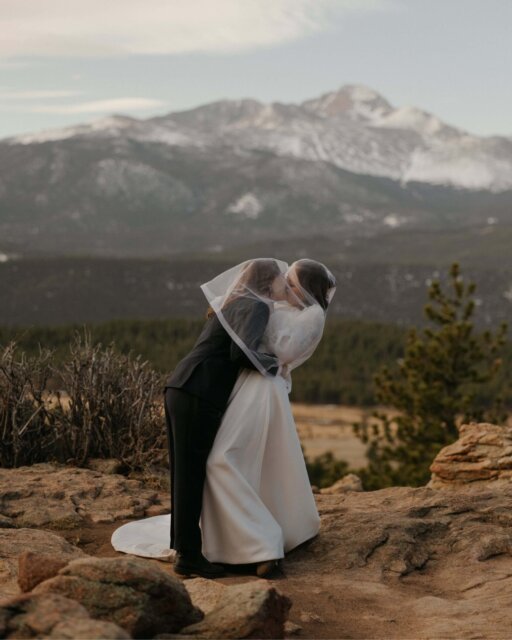 Elisa (she/her) and Vic (she/they) talked about eloping on their very first date. From that moment, they both knew a big traditional wedding wasn’t their path. They imagined something intentional, surrounded by nature, built completely on their own terms.

After moving to Colorado with their dog and three cats, they planned a sunrise ceremony at 3M Curve in Rocky Mountain National Park - just four of their closest friends, a handful of personal details, and a day that'd reflect the life they’d built together ❤️

They woke at 3:30 a.m. to get ready - Elisa did both her own and Vic’s hair and makeup - before driving into the park for a 6 a.m. ceremony. They shared private vows through tears, then invited their friends to join for traditional vows and a kiss to seal the deal. 

After photos, they stopped by the visitor centre to stamp their vow book, while their friends napped in the car. Back at their Airbnb, the day turned into an evening of cooking a five-course meal together, drinking wine, spinning records, and dancing. 

They ended the night with a first dance to Pastels by The Brook and The Bluff - and, cake.

Fun Fact: they’d actually made it legal months earlier - self-solemnizing at sunrise on June 13 2024 at Dream Lake, Rocky Mountain National Park, with a license from Boulder County and a film camera in hand 🌹 So when this day arrived, it wasn’t about paperwork at all, it was a celebration of everything they’d already promised each other.

This *delightful* tale is up for you to lust over, over on the blog. Linked up in the usual spot for you.

Featured in @dancingwithher
Photography by @jamietobinphoto 
Lovers @lissie.lane & @vicinthefastlane

Suit @indochino
Dress @brilliantbridal