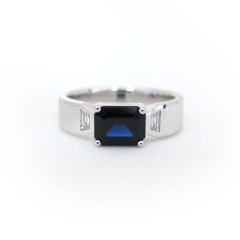 Emerald-cut-dark-blue-sapphire-ring-with-trapeze-diamonds-in-white-gold-Fairina-Cheng-Jewellery - Fairina Cheng