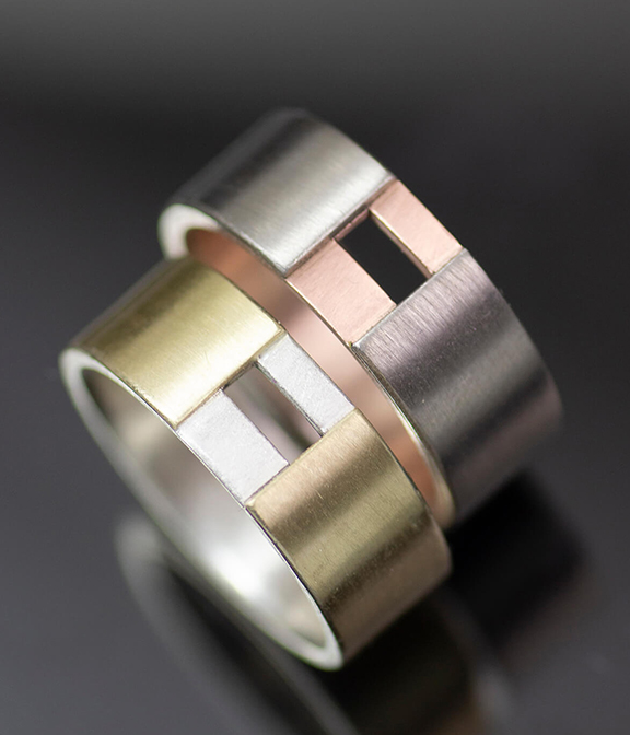Lolide Seattle USA is a lesbian, gay, queer LGBTQIA+ wedding and engagement jeweler crafting this mixed metals cut out rings set