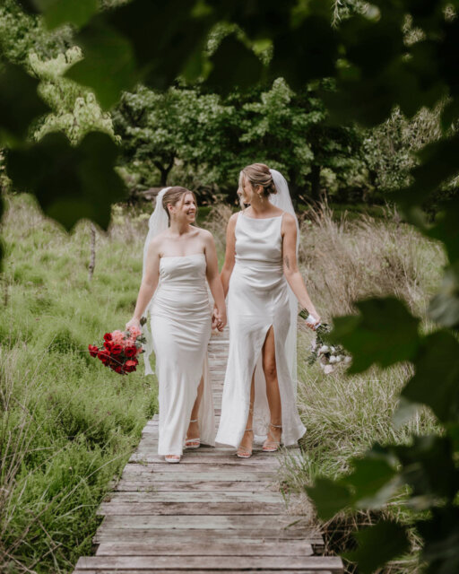 Can we just talk about main character energy for a second? Because Natalie (she/her) & Susanna (she/her) didn’t just have a wedding; they had a whole moment ✨⁠
⁠
They got married on Valentine’s Day (romantic! iconic! we love it), exactly four years and one day after they officially became girlfriends. But the real highlight? The resilience.⁠
⁠
Picture this: The reception is in full swing, and Susanna accidentally knocks a glass of red wine all over Natalie’s dress while hugging a guest. Panic? Absolutely not. While two guests scrubbed the dress with stain remover, Natalie just stood there eating pizza, completely unbothered. That is the level of chill we are aspiring to in 2026.⁠
⁠
From the "Vintage Valentine" theme where guests wore touches of pink and red , to the red sports car photos with heart-shaped sunnies , every detail at @malibraefarm was 10/10.⁠
⁠
You can read the full story (and see the dress recovery!) over on the blog. ⁠
⁠
It’s linked up in the usual spot, like always ❤️⁠
⁠
Featured in @dancingwithher⁠
Captured by @capturedby_kate⁠
Lovers @natalie_shh & @sannakat⁠
⁠
Celebrant @katie_king_marriage_celebrant⁠
DJ @daniellelambmusic⁠
Dress @becandbridge⁠
Hair & Makeup @maeyoube⁠
Rings @megmaskellfinejewellery⁠
Venue @malibraefarm