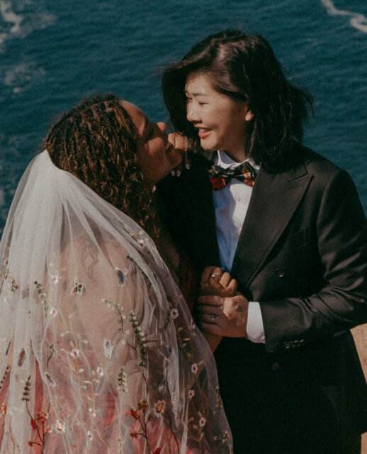 Beth and Jaycee’s wedding was as much about family as it was about the two of them. But “family” didn’t just mean parents and siblings - it stretched wide, through culture, music, and chosen community.⁠
⁠
They invited Vietnamese, Afro-Panamanian, and Texan traditions to meet in the desert. They lit candles for ancestors, tasted the elements of marriage, and danced in a Panamanian Las Arras ritual. They skipped the father-daughter dance for a family dance, skipped gendered wedding parties for “our favorite people.” ⁠
⁠
Even their send-off wasn’t just the two of them slipping away quietly - it was 114 guests in the pool, fully clothed, fully in it together.⁠
⁠
The whole week felt like this: scuba dives, mariachi welcome parties, cousins singing, moms performing ABBA in sequins. ⁠
⁠
A wedding, yes, but also a collective adventure that said: queer love isn’t celebrated in isolation. It flourishes because of community, and it throws one hell of a disco when everyone shows up 🌈⁠
⁠
The full mariachi-meets-sea-lion version of events is up on the blog, waiting for you - it's linked up in the usual spot for ya 👆⁠
⁠
Featured on @dancingwithher⁠
Captured by @dinorahavilaphoto⁠
Lovers @vietnamtopanama⁠
⁠
Caterer @dum_todossantos⁠
Cake @mariel_pastry⁠
Ceremony Venue @ranchocorazon.todos⁠
Dress @thesentimentalistatl⁠
Engagement Rings @valeriemadisonjewelry⁠
Florist @casaaura.todos⁠
Hair @kokoabeni⁠
Live Music @california_brass⁠
Officiant @ka.wedding.officiants⁠
Suit @ericaustincustom⁠
Videographer @dulceotruco.8