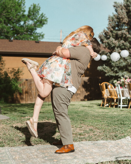 Cate (she/they) & Laura (she/her) just raised the bar for proposals, and we are unwell 🥹⁠
⁠
From a first date at the aquarium (with roses!) to a proposal disguised as a photo booth session, their love story is pure cinema.⁠
⁠
The highlights: A surprise "Will You Marry Me" photo strip. A backyard transformed with rainbow lights. Friends flying in to surprise them. Rings bought spontaneously after brunch.⁠
⁠
Cate said they both blacked out in the best way possible, and honestly? We would too.⁠
⁠
Run, don't walk, to the link in our bio to see the full reveal. It’s up now! ✨⁠
⁠
Featured in @dancingwithher⁠
Photography by @kateivyphotography⁠
Lovers @catehairmakeup & @raaberwocky