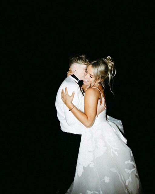 Ash had a grand plan. It involved Penguin Island, a professional camera crew, and a metaphor about penguins mating for life. It was supposed to be the 'perfect' proposal.

Then, life happened. COVID shifted the coordinates, and the 'perfect' proposal became a spontaneous moment in their living room on Ash’s 30th birthday - tipsy on champagne, with Ash’s daughter Mckenzie and their spoodle, Harry Winston, right there in the middle of the chaos. It wasn't the island, but it was exactly them.

They first met at a Jungle Body mega class in 2015, but the spark didn't truly catch until a Facebook message and a starlit picnic at Cottesloe Beach four years later. Since then, they’ve been building a life that balances Ash’s eye for design and sports stats with Rosie’s 'boss babe' energy as a CEO.

Their wedding at Sandalford Winery was a reflection of that balance: black velvet and gold details, a one-of-a-kind Tuscany Bridal princess gown, and a vibe that felt both incredibly high-end and deeply personal. They ditched the traditions that didn't fit, wrote vows to Kenzie, and danced into their marriage to Tim Halperin.

"Marriage is a daily choice," Rosie says. And at Sandalford, under a canopy of fairy lights and surrounded by the people who fight for them, that choice looked like pure magic.

Ash & Rosie’s elegant winery wedding is now live on the blog 💫
www.dancingwiththem.com/ash-rosie-wedding

Featured on @dancingwiththem 
Captured by @maeganbrownmoments